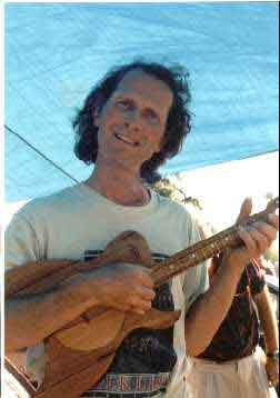 Functioning ethomusicologist with Tahitian Uke, interpreting the event for the press at WOMAD 1999